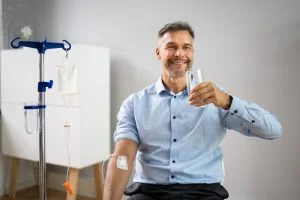 man receiving iv therapy