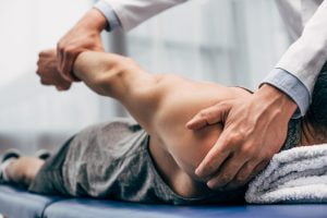 man getting spine realigned by a chiropractor