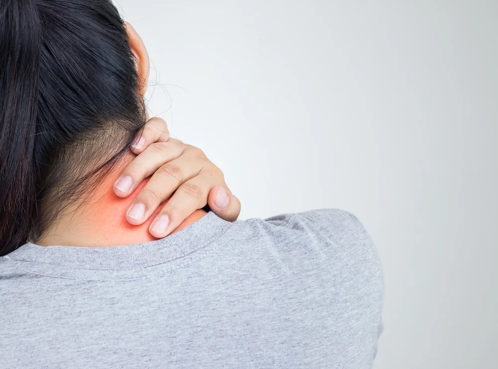 woman holding neck because it is painful