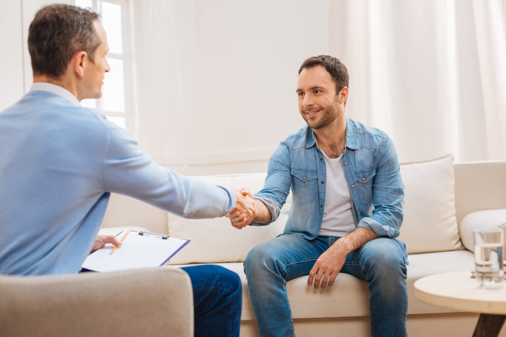 male patient shaking hands with doctor about testosterone replacement therapy